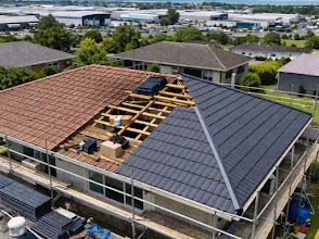 Aerial view of a re-roof in progress on a Launceston home