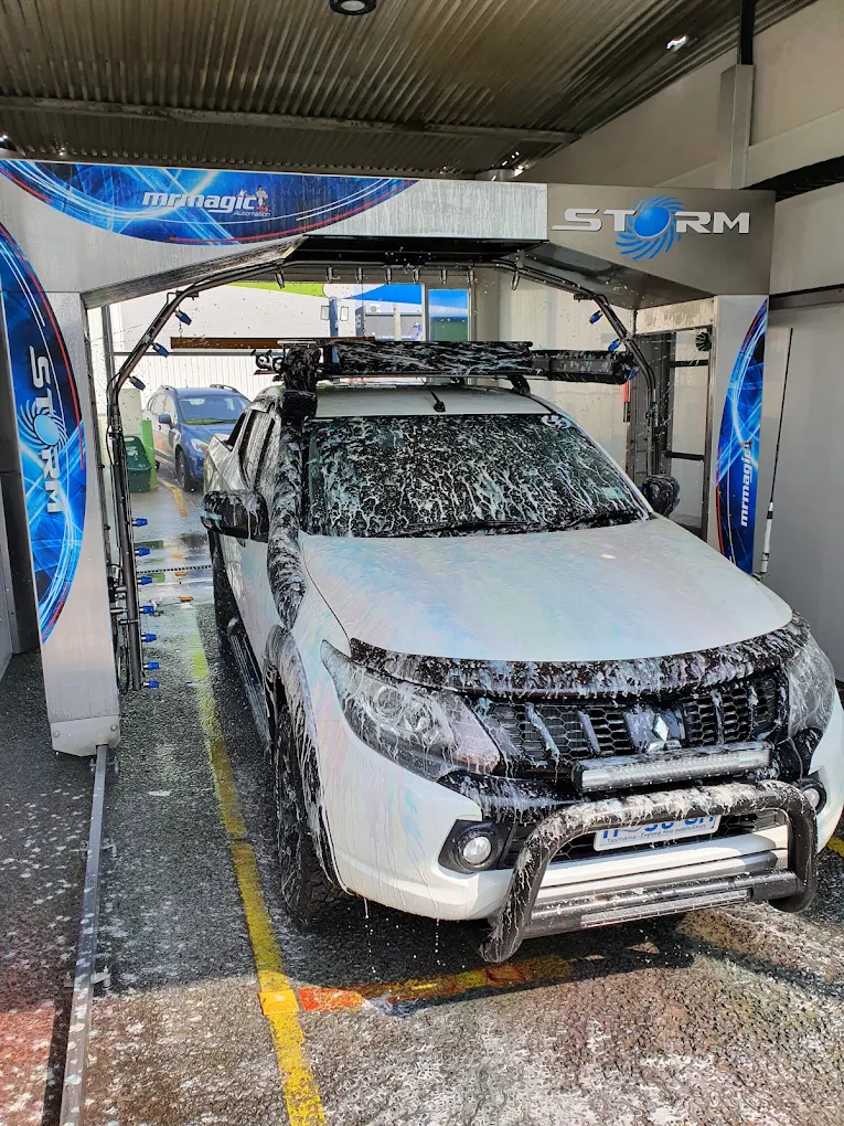 Vehicle being foamed inside the STORM touch-free automatic wash